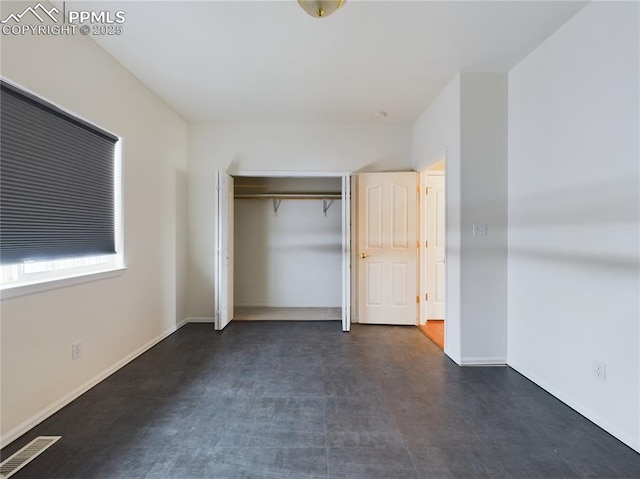 unfurnished bedroom with a closet