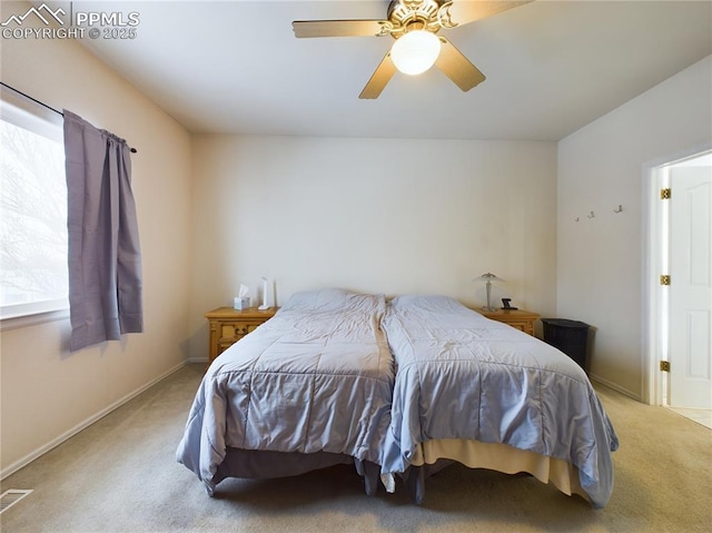 bedroom featuring light carpet and ceiling fan