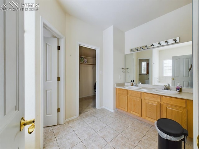 bathroom with vanity and tile patterned flooring