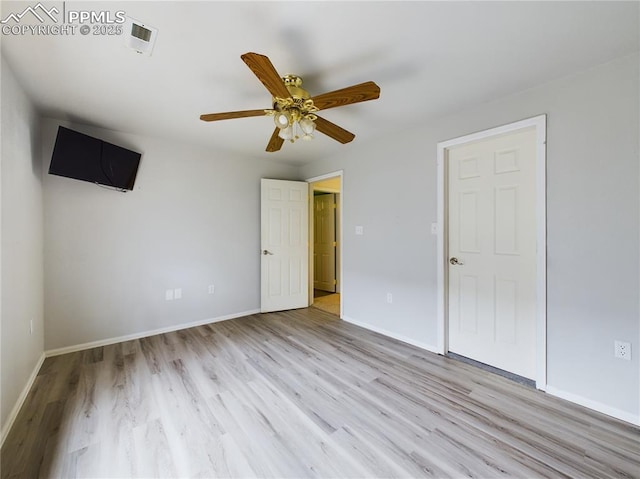 unfurnished bedroom with light hardwood / wood-style flooring and ceiling fan