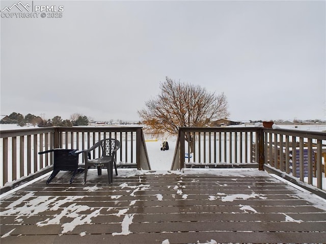 view of snow covered deck