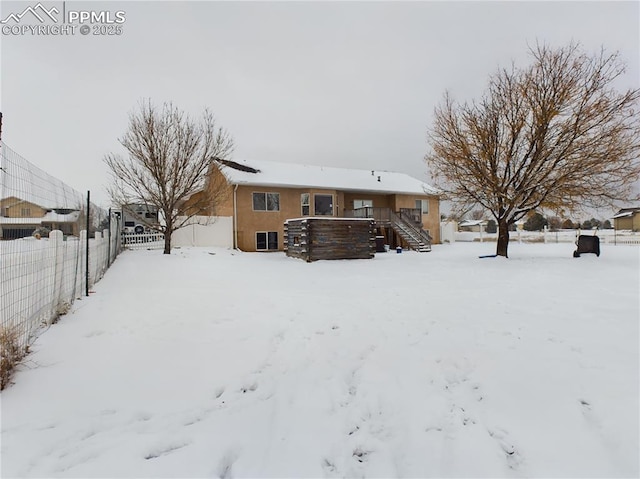 view of snow covered property