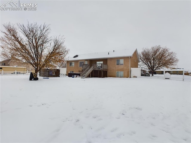 view of snow covered house