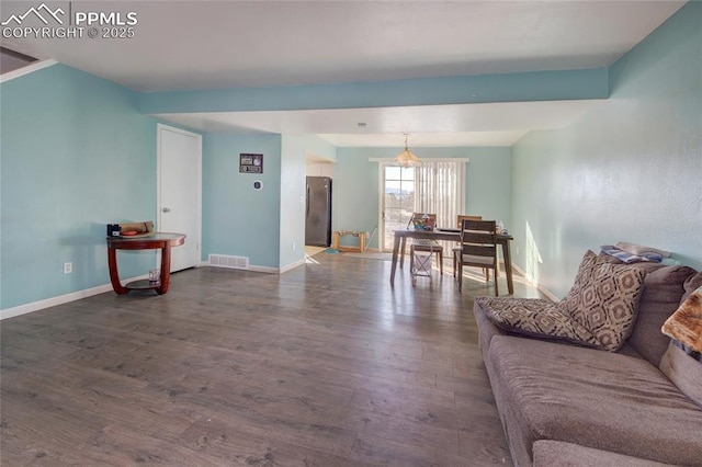 living room featuring dark hardwood / wood-style flooring