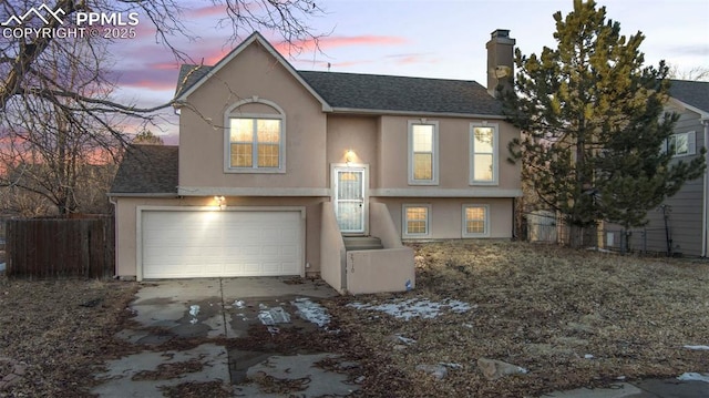 split foyer home featuring a garage