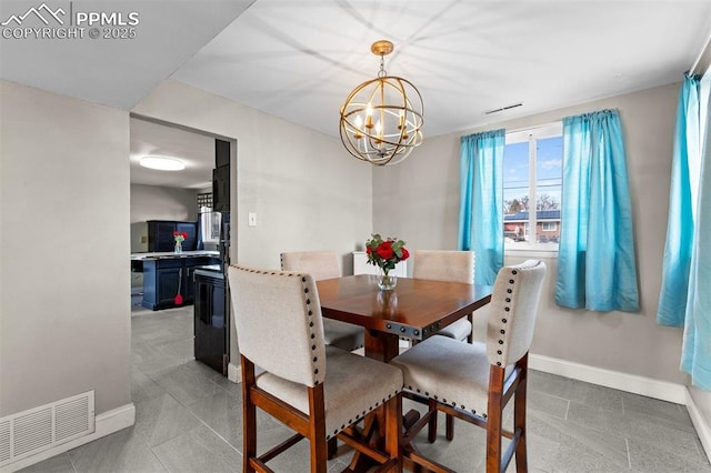 dining area featuring a notable chandelier