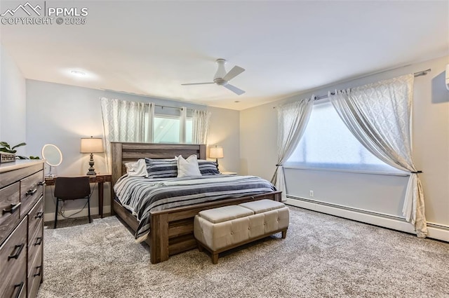 bedroom featuring ceiling fan, a baseboard radiator, and light carpet