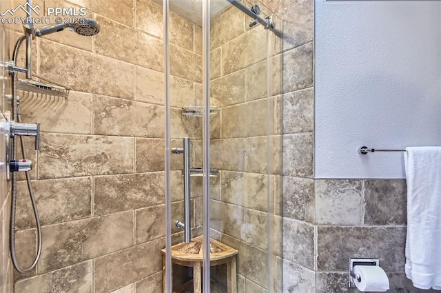 bathroom with tiled shower