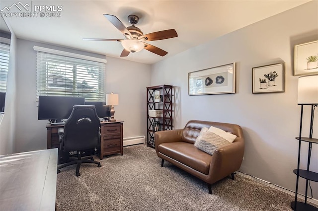 office space featuring a baseboard heating unit, ceiling fan, and carpet flooring