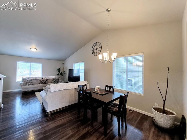 dining space with vaulted ceiling, dark wood-type flooring, and a notable chandelier