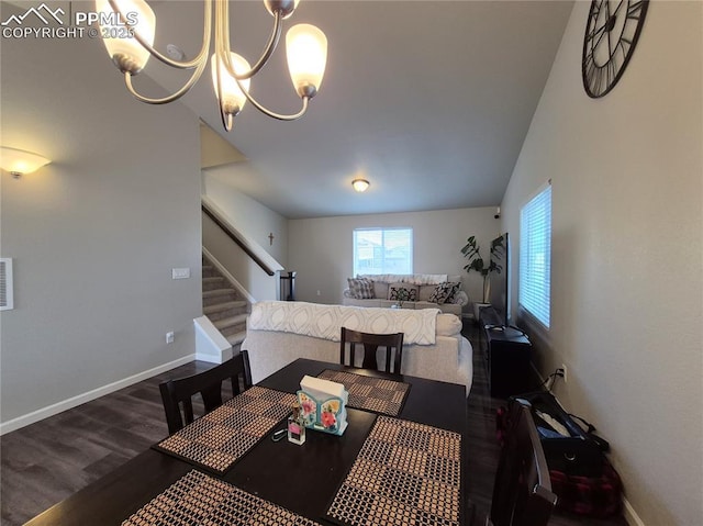 dining room featuring dark hardwood / wood-style flooring and a chandelier