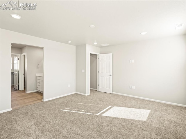 unfurnished room with carpet floors, recessed lighting, and baseboards