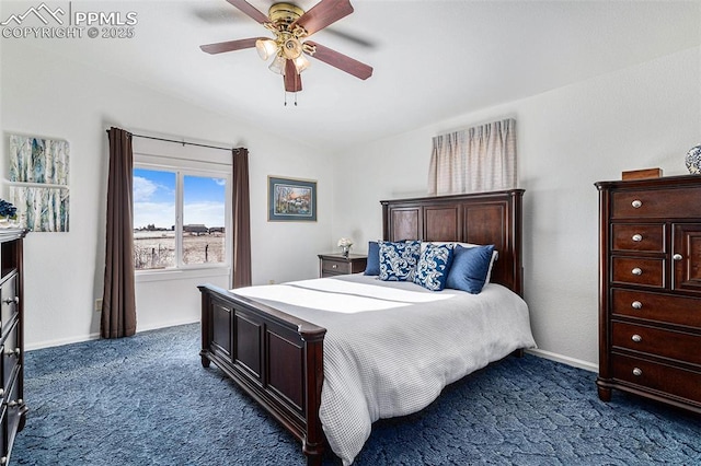 bedroom with dark colored carpet and ceiling fan