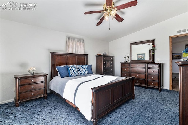 carpeted bedroom with ceiling fan and vaulted ceiling