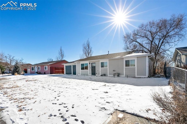 view of snow covered house