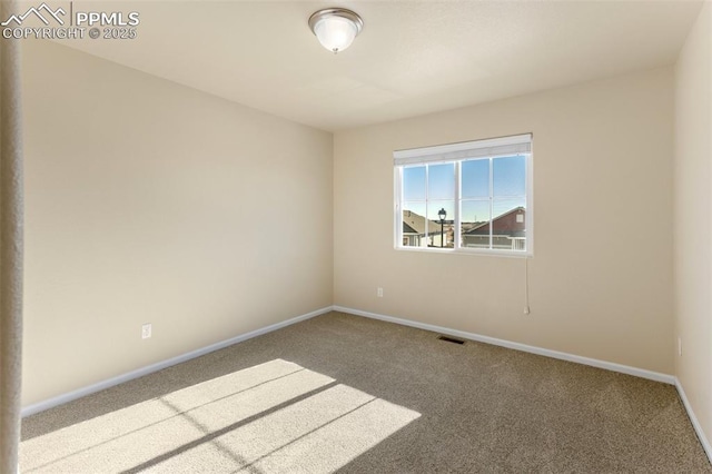 unfurnished room featuring carpet flooring