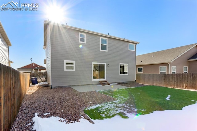 rear view of property with a patio and a yard