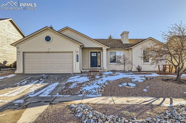 ranch-style home featuring a garage