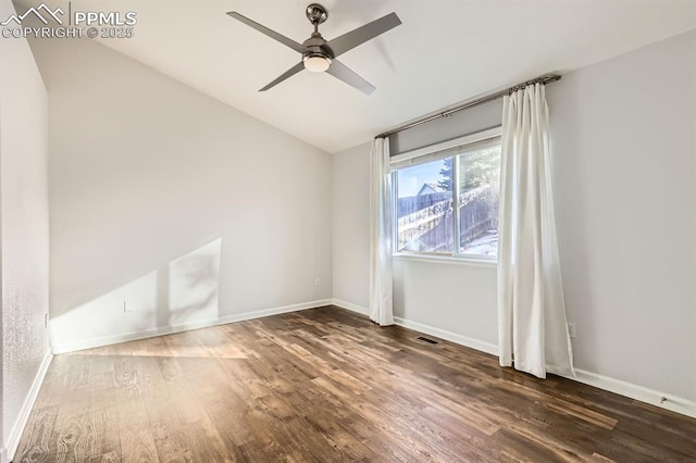 unfurnished room featuring dark hardwood / wood-style floors and ceiling fan