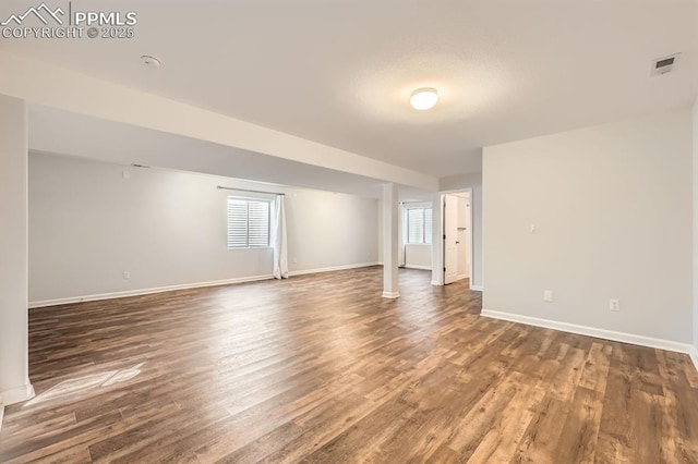 spare room featuring dark hardwood / wood-style flooring