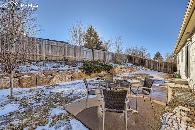 view of snow covered patio