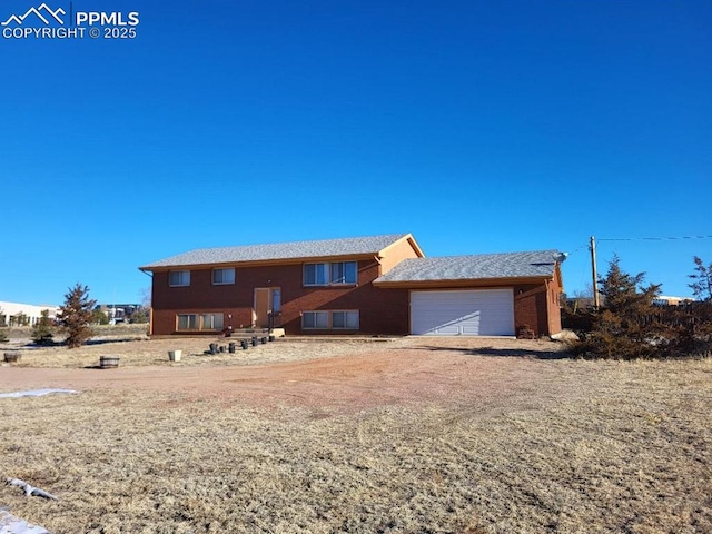 view of front of property featuring a garage