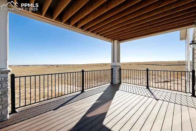 wooden terrace with a rural view