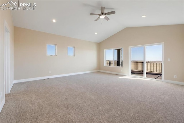 unfurnished living room featuring vaulted ceiling, light colored carpet, and ceiling fan