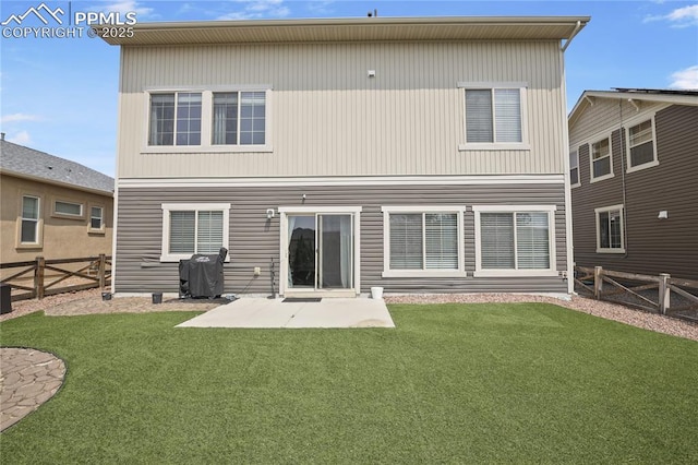 back of property featuring a patio area and a yard