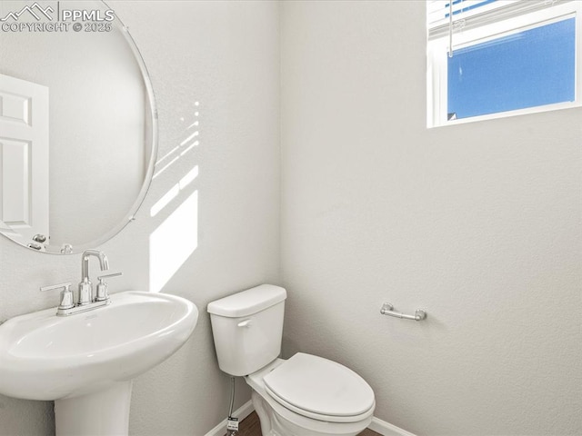 bathroom with toilet and sink