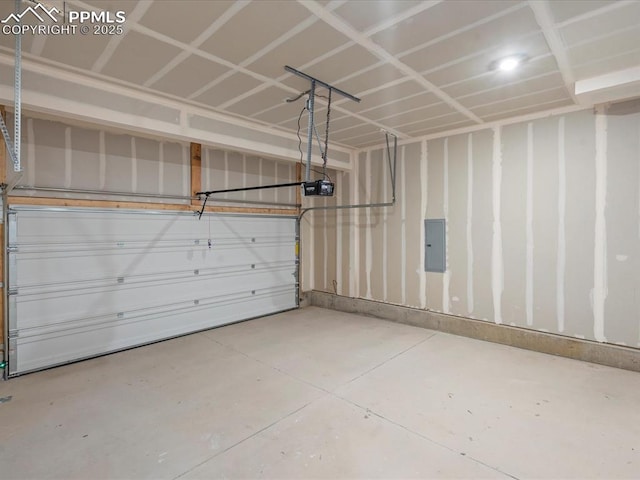 garage with electric panel and a garage door opener