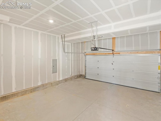 garage featuring a garage door opener and electric panel