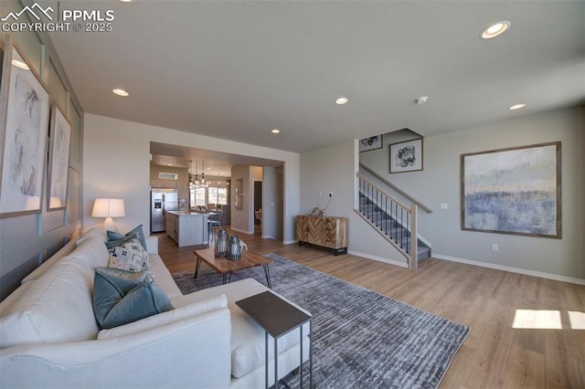 living room with light hardwood / wood-style floors