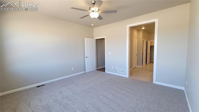 unfurnished bedroom featuring carpet floors and ceiling fan