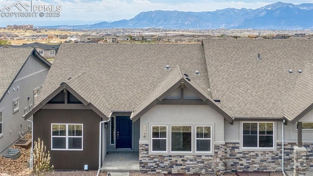 rear view of house with a mountain view