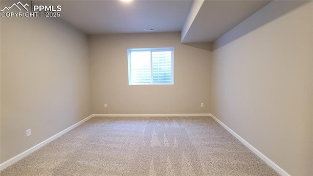 unfurnished room featuring carpet