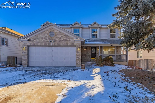 view of front of property featuring a garage and a porch