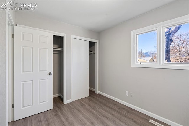 unfurnished bedroom with light hardwood / wood-style flooring