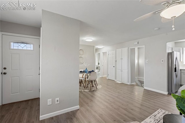 entryway featuring ceiling fan and hardwood / wood-style flooring