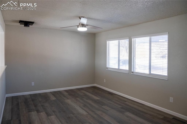 unfurnished room featuring a textured ceiling, ceiling fan, and dark hardwood / wood-style floors