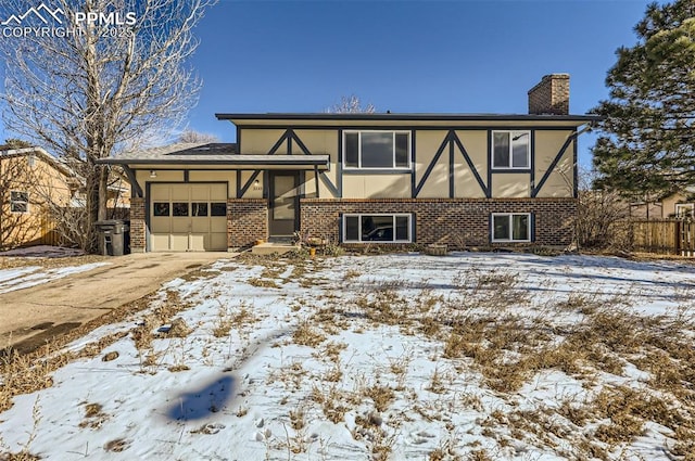 tudor home featuring a garage