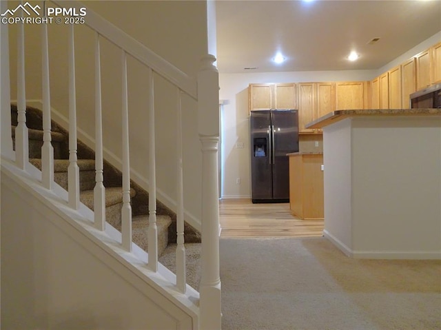 stairs featuring carpet floors