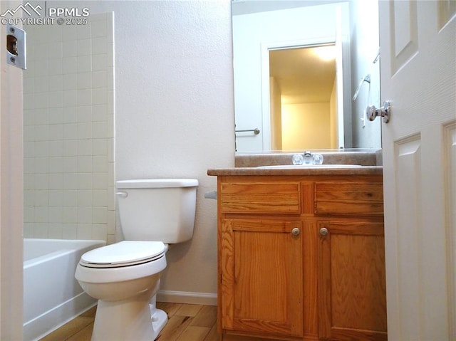 full bathroom with wood-type flooring, vanity, toilet, and shower / tub combination