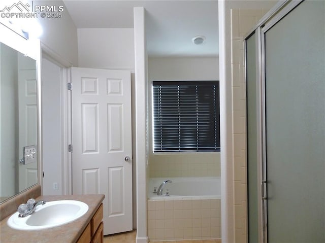 bathroom featuring tile patterned flooring, shower with separate bathtub, and vanity