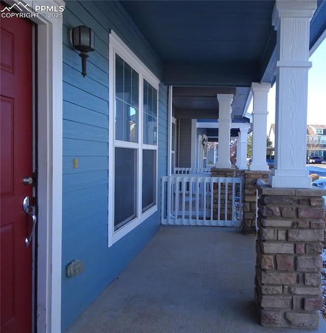 view of patio featuring a porch