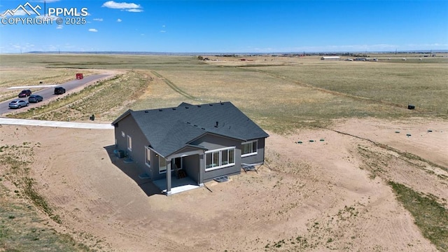 birds eye view of property featuring a rural view