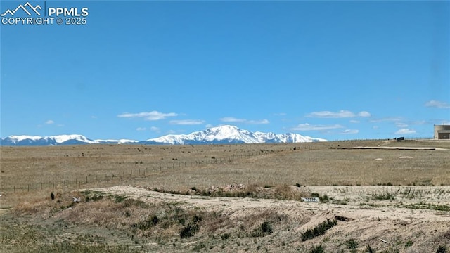 view of mountain feature with a rural view