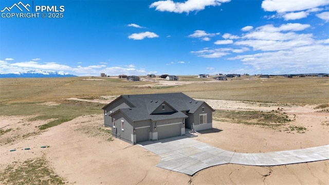 birds eye view of property featuring a rural view