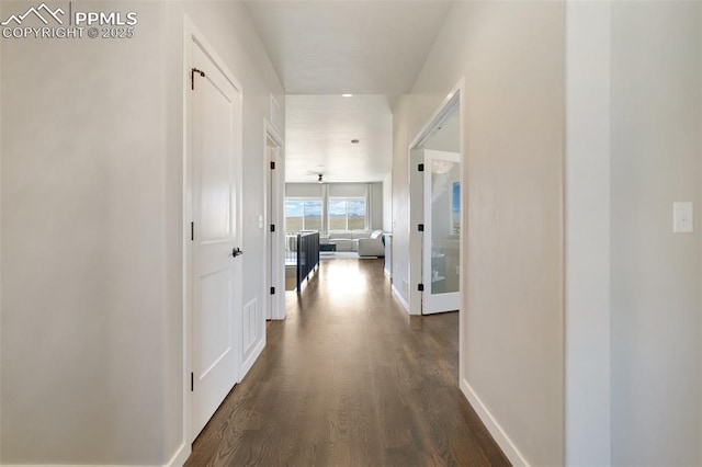 hallway featuring dark hardwood / wood-style floors