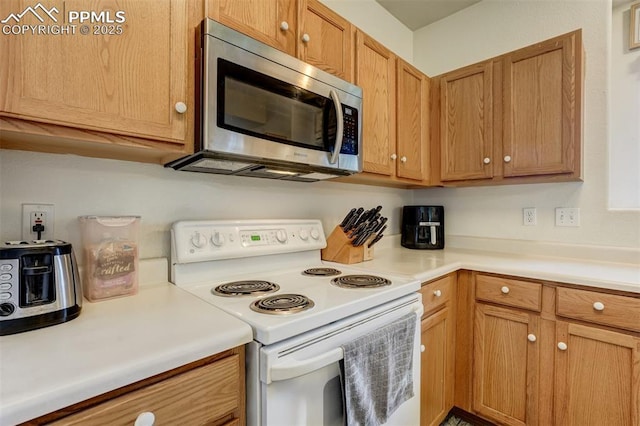 kitchen featuring white electric stove